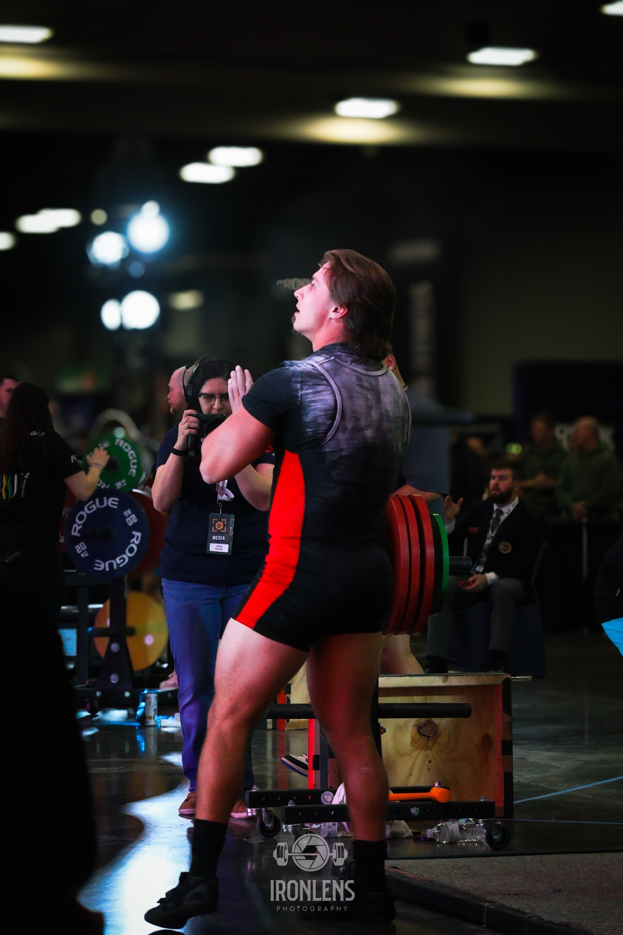 Photographer capturing powerlifting moment